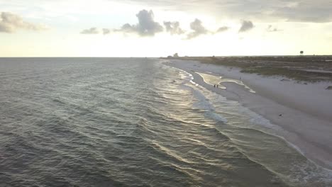 Beautiful-Long-Stretch-Of-Sandy-Beach-At-Sunset---aerial-drone-shot
