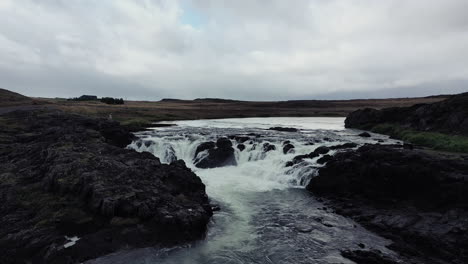 Low-flight-over-rapids-of-river-in-Iceland
