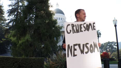 Male-Political-Protester-with-Gruesome-Newsom-Sign