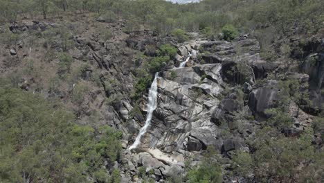 Davies-Creek-Falls-And-Tropical-Rainforest-In-The-Far-North-Region-Of-Queensland,-Australia---aerial-pullback