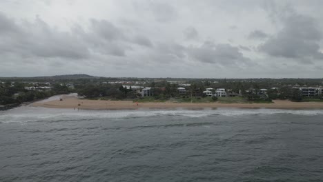 Aerial-View-Of-The-Coastline-At-Bargara-Queensland-Australia-On-A-Cloudy-Day---drone-shot