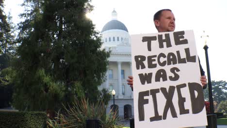 Male-Political-Protester-with-The-Recall-was-Fixed-Sign