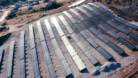 Drone-shot-of-solar-panel-rows-at-a-solar-power-facility