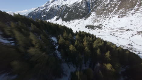 Spectacular-aerial-fpv-drone-shot-over-trees-of-mountainside,-Pyrenees