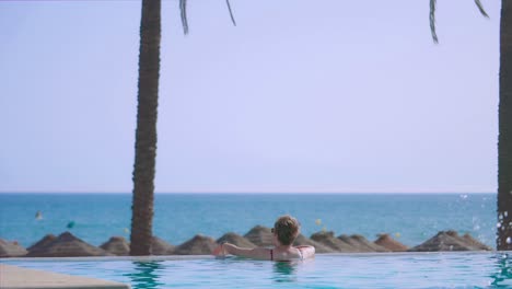 Woman-enjoying-the-view-from-the-Infinity-Pool