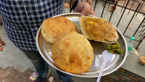 Club-Kochuri,-kachori-of-kachauri-is-a-spicy-snack,-fried-dumpling-and-a-very-popular-street-food-available-at-Sharma-snacks-at-Kolkata,-India