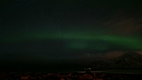Northern-lights-or-Aurora-Borealis-over-the-sea-in-Lofoten-Islands-in-Norway
