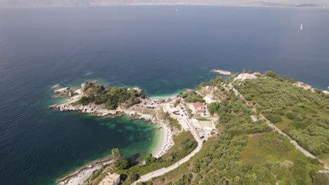 Aerial-view-of-Rocky-small-beaches-of-Kassiopi-Coastline,-Turquoise-water-color,-Corfu-Island