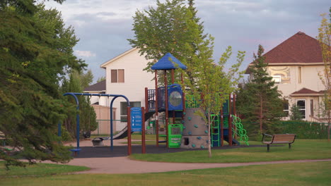 Playground-located-in-a-neighbourhood-during-summer-in-Alberta,-Canada