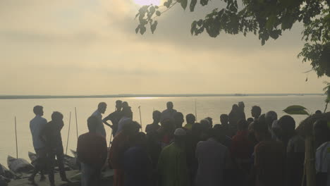 Riverside-fish-market-of-Bangladesh-and-people-gathering-4k-silhouette-422-10-bit-footage