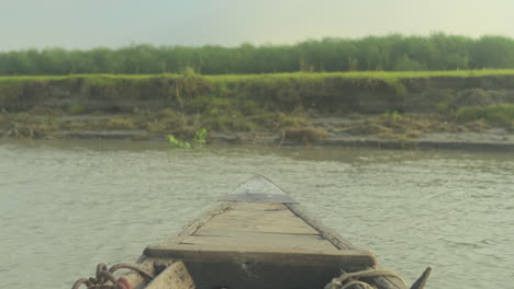 Boat-approaching-towards-river-bank-in-Bangladesh-4k-stock-footage-422-10-bit