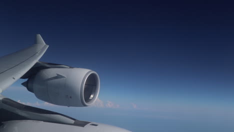 Plane-Engine-On-Wing-Against-Blue-Skies