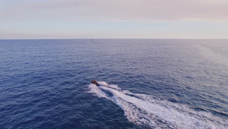 Dronefootage-of-following-a-jetski-on-the-open-water-close-to-the-coast