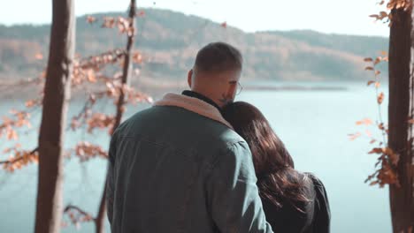 Couple-hugging-and-admiring-the-lake-view