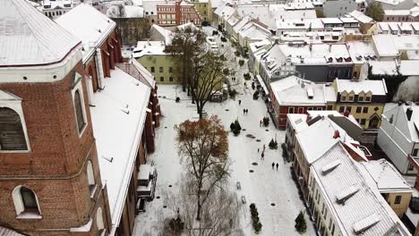 Kaunas-old-town-with-bell-tower-of-Cathedral-in-winter-season,-aerial-drone-view