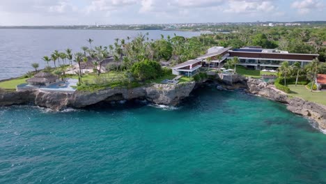 Aerial-view-showing-private-bay-in-front-of-luxury-hotel-With-private-garden-and-Ocean-view---Case-de-Campo,-Dominican-Republic
