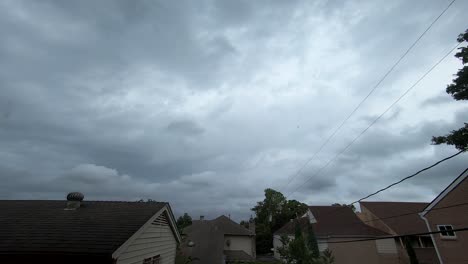 Timelapse-of-cross-directional-clouds-swirling-leading-to-big-storm-in-the-afternoon-over-Texas-neighborhood