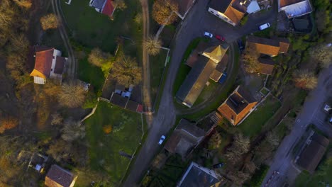 Drone-shot-above-a-little-french-village-during-sunset
