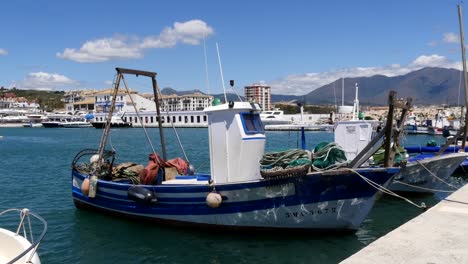 Static-Mid-Shot-of-Traditional-Spanish-Fishing-Boats-at-Puerto-de-La-Duquesa-in-Spain