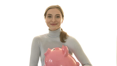 A-woman-hugging-a-piggy-bank-in-which-she-holds-savings-for-retirement