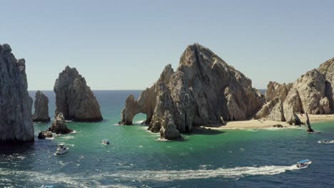 Impressive-Rock-Formations-and-Natural-Arch,-Landmark-of-Cabo-San-Lucas,-Mexico,-Aerial-Approaching