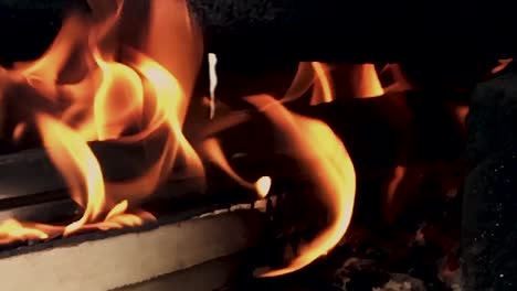 Slow-Motion-Closeup-on-the-fire-of-Indian-traditional-style-hand-made-fire-place-to-cook-the-food-with-wood---coal-etc