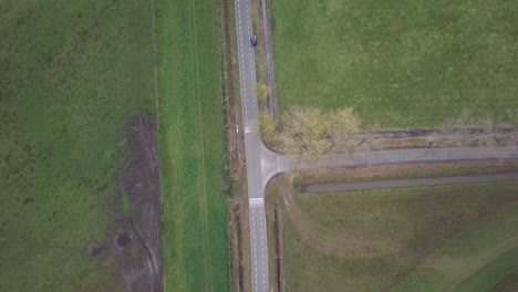 Aerial-drone-shot-of-the-road-in-the-countryside-in-the-Netherlands