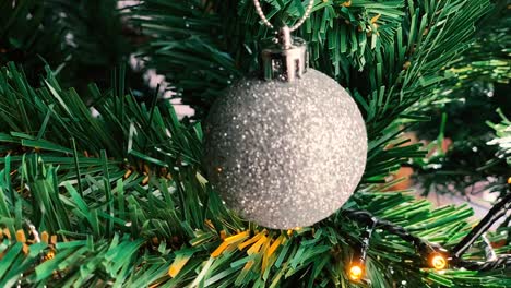 Round-Christmas-bulb-decorations-on-spruce-branch-tree