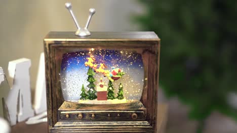 toy-tv-falling-snow-background-from-Christmas-tree