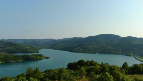 Lake-Butoniga-water-reservoir-dam-in-Croatia-wide-angle-panorama-forward-approach,-Aerial-drone-flyover-shot