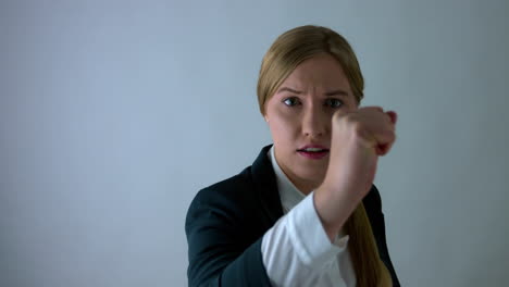 Slow-motion-shot-of-fearful-Blonde-Woman-protect-herself-with-beating-fist