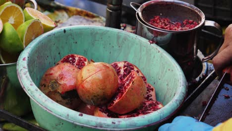 Close-up-shot,-slicing-a-pomegranate-fruit-in-half