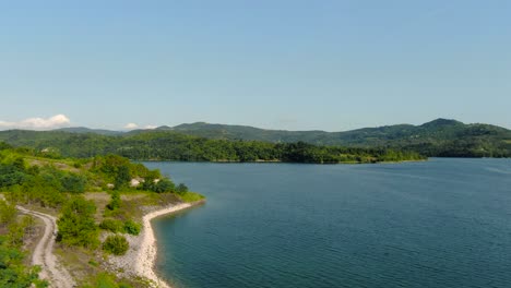4k-aerial-drone-flight-over-shoreline-of-European-man-made-lake