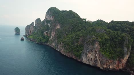 Drone-Aerial-View-of-Steep-Limestone-Cliffs-Over-Andaman-Sea,-Thailand