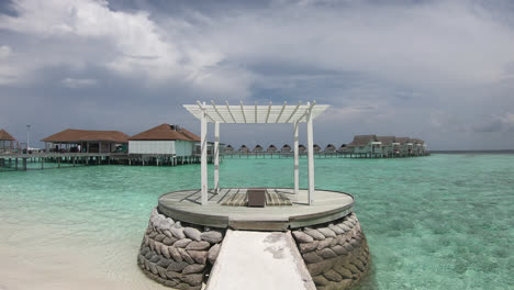 white-arch-with-bungalow-and-ocean-sea-background-in-Maldives