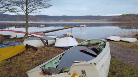Many-row-boats-docked-off-the-water-near-the-lake-and-some-flooded