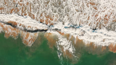 aerial-shot-from-waves-breaking-in-Portugal-on-the-algarve-beaches