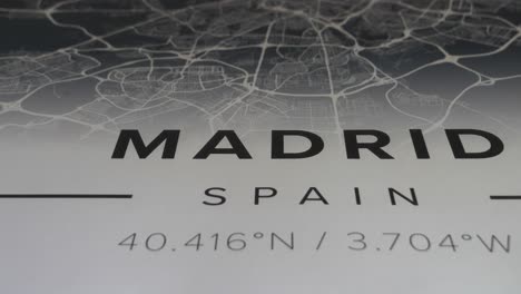 Madrid-title-text,-map-of-the-city-and-coordinates,-revealing-slider-shot