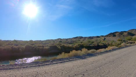 POV-driving-on-dirt-road-along-Gila-Gravity-Irrigation-Canal---Yuma-Arizona