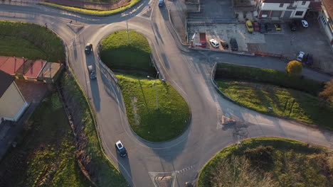 Vehicles-circling-around-the-small-double-roundabout-with-a-water-channel
