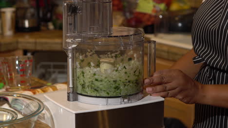 Mincing-onions-and-chopped-zucchinis-using-a-food-processor---Close-up
