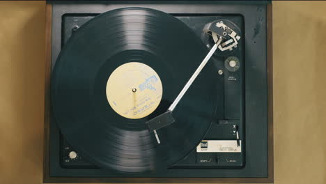 Cinematic-overhead-shot-of-a-record-spinning-on-a-turntable