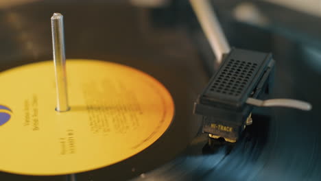 Close-up-of-a-vintage-lp-vinyl-record-spinning-on-a-turntable