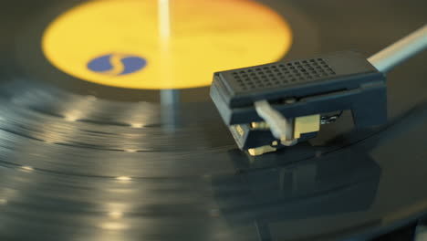 Pan-across-a-spinning-lp-vinyl-record-on-a-turntable