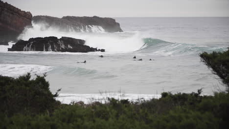 Surfers-paddling-in-the-line-up-waiting-for-waves