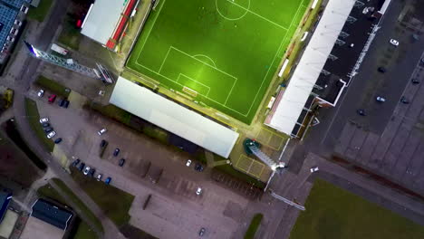 Top-down-aerial-of-soccer-players-playing-football-in-stadium