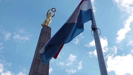 Golden-lady-of-Luxembourg-with-flag