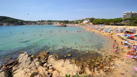 Beautiful-Mediterranean-beach-of-the-Costa-Brava-Girona-leafy-green-vegetation-and-turquoise-blue-sea