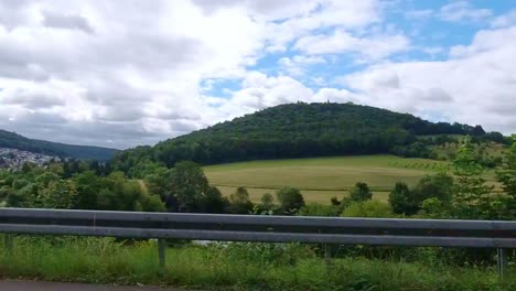 Fast-passing-view-of-beautiful-landscape-during-overcast-summer-day,-Neckarsteinach-Germany