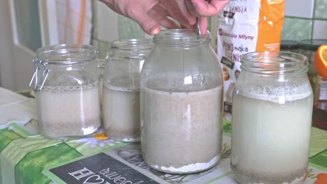 Mixing-sourdough-in-a-big-jar-to-create-the-bacteria-driven-soup-base